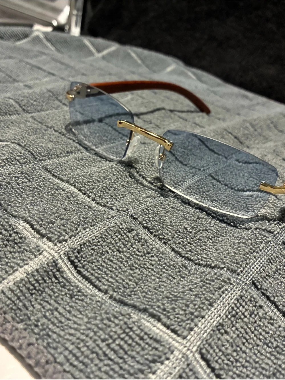 Rimless Blue Lens Sunglasses with Wood Arms and Gold Bridge